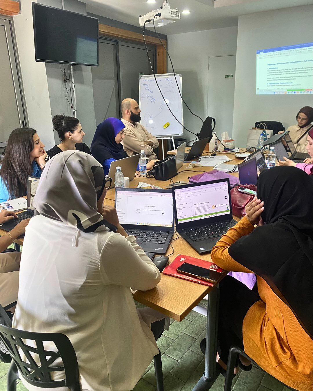 Bedayati learners working together during a web development session